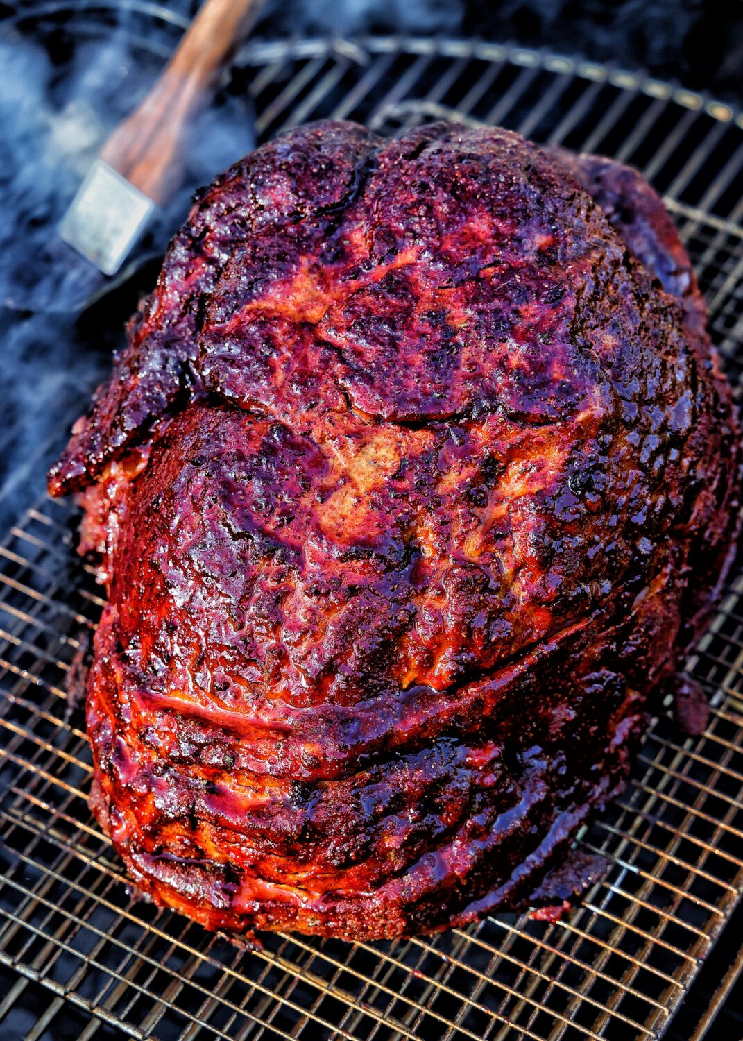 Double-smoked Easter Ham with a caramelized Blueberry-Bourbon Glaze all prepared over live fire.